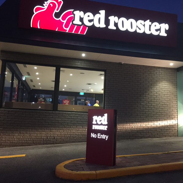 red rooster illuminated freestanding sign